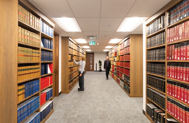 Shelves of legal books in Fillmore Riley’s office library.