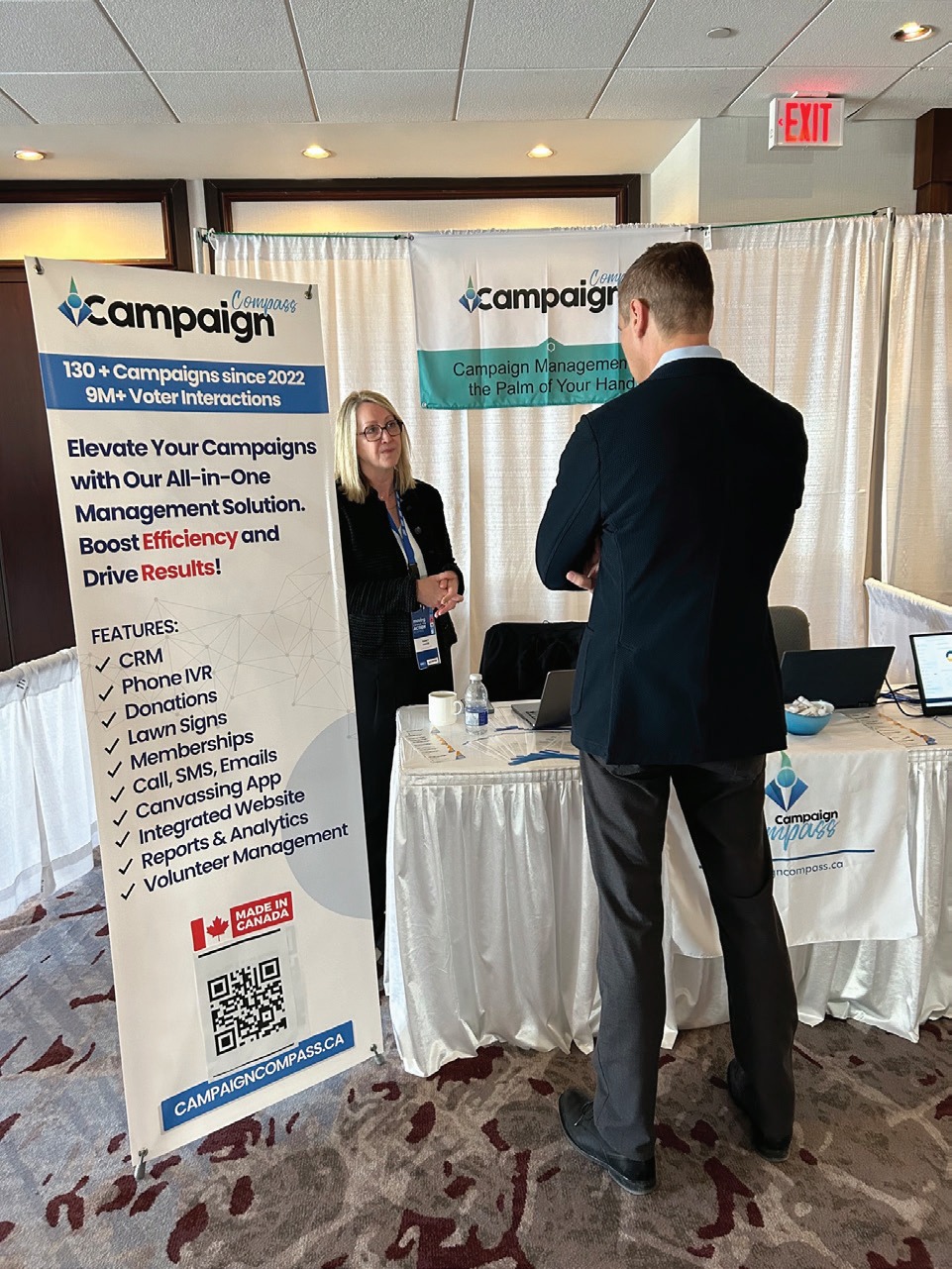 Nancy Cooke at a 2025 networking event speaking with a prospective Campaign Compass customer.